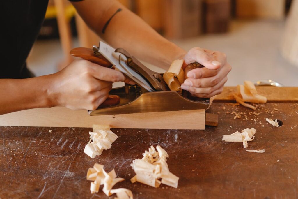 carpenter at work sanding wood